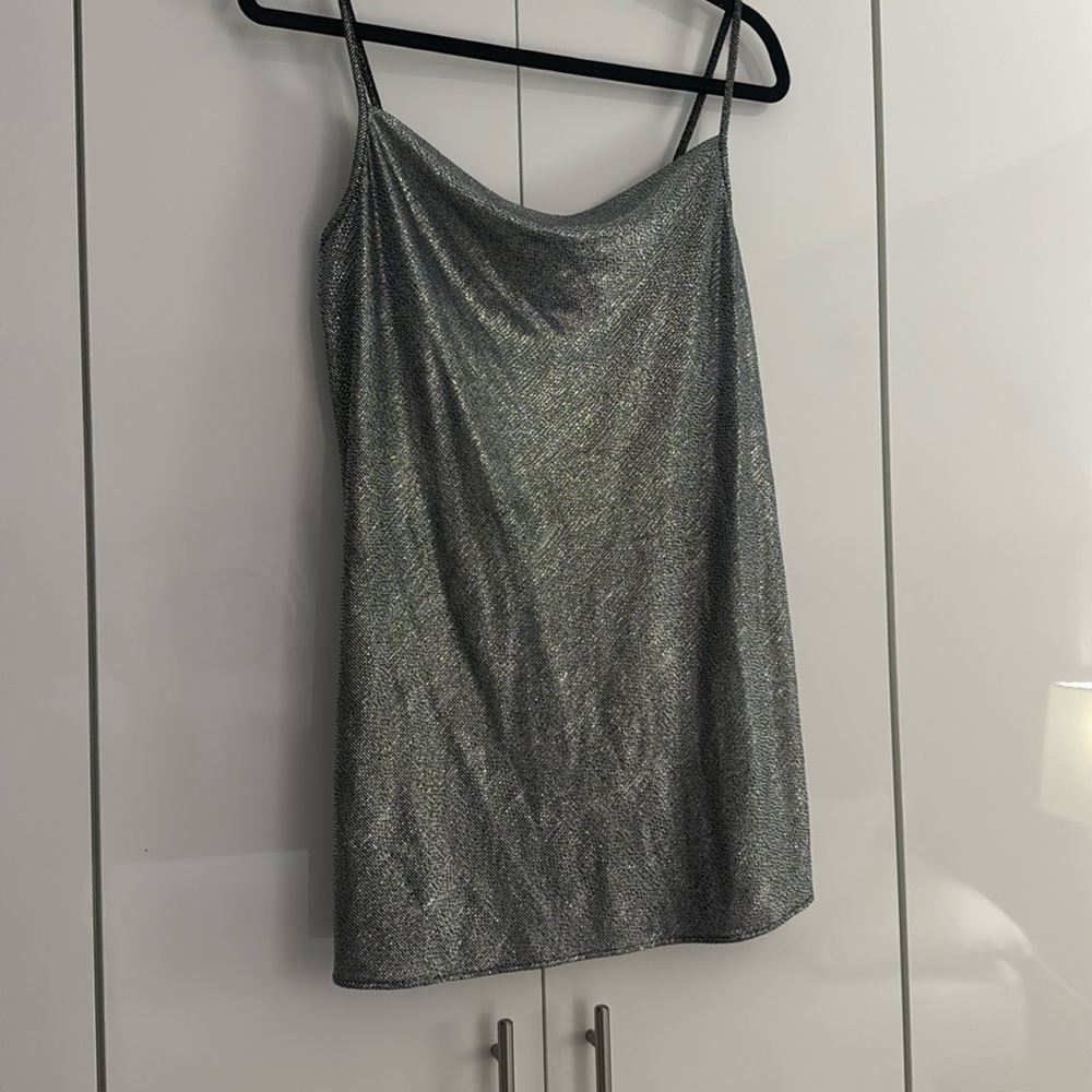 It is a size SX that runs large and can also be worn as a dress